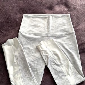 Lululemon crop leggings in silver grey pinstripe design and light grey details